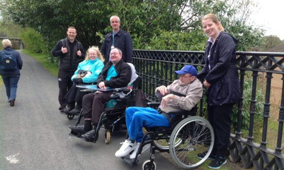 Three wheelchair users and three walkers.